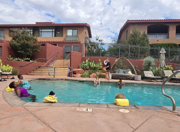 The group spending time together by the resort pool